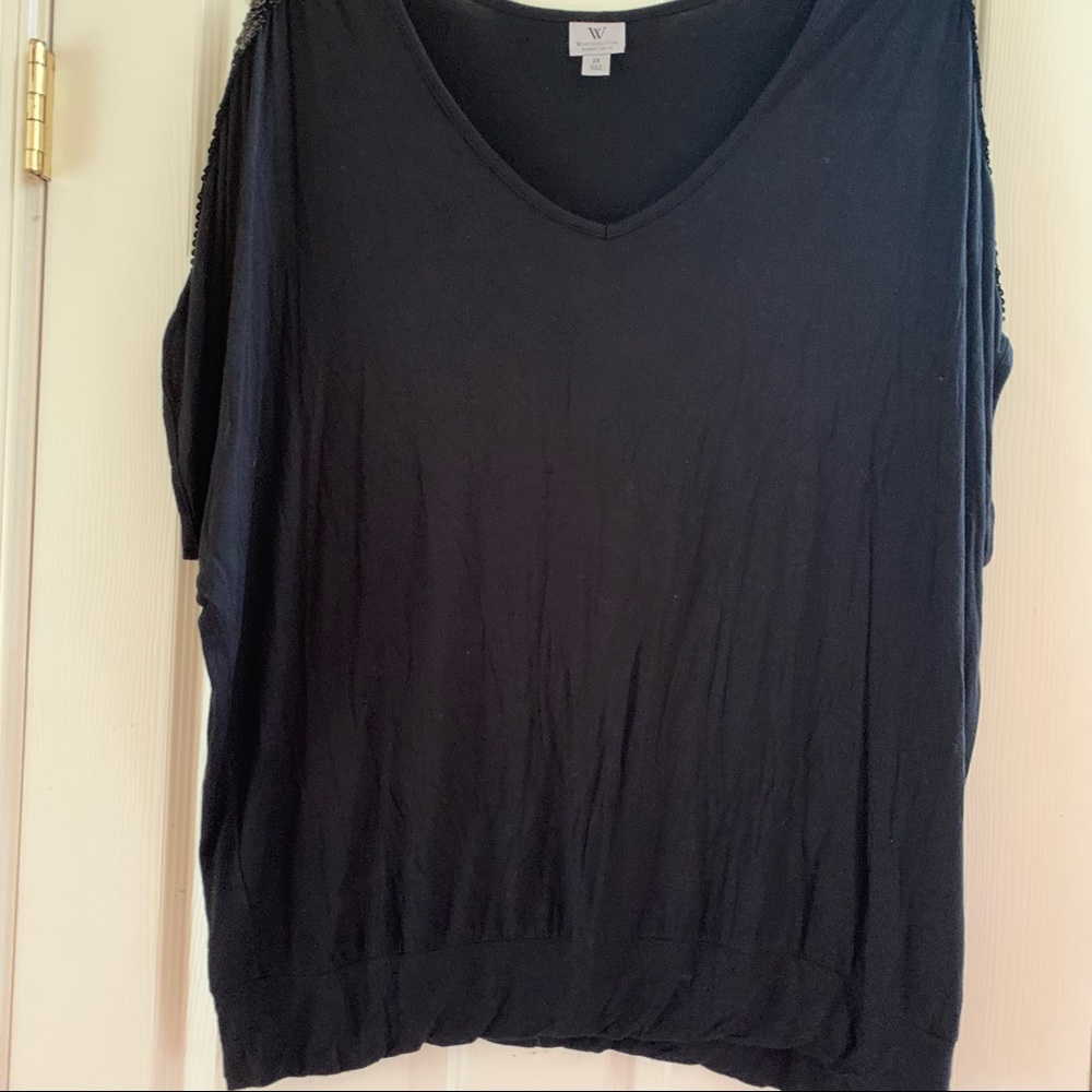 Black shirt with sequins on the arm.